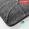 A close-up view of a dark gray bath mat with a leaf-like texture. Produktbild-Vorschau