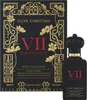 A product shot of a perfume bottle and its box, both featuring ornate gold floral designs on a black background. Podgląd zdjęcia produktu