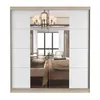 A mirrored wardrobe with white doors and a wood-tone frame, reflecting a bedroom interior. Voir les images du produit