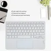 A flat lay of a white keyboard with a cup of coffee, a tablet, a smartphone, and a notebook on a white surface. Náhľad obrázku produktu