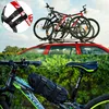 A collage showing a car with bicycles on the roof and a close-up of a bicycle with a bag attached. Produktbild-Vorschau