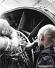 A mechanic is working on a jet engine. Produktbild-Vorschau