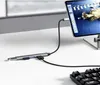 A USB hub is connected to a tablet or laptop, with a keyboard in the foreground. Náhled obrázku produktu