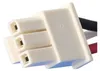 Close-up of a white electrical connector with three terminals and wires attached. Produktbild-Vorschau