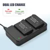 A dual battery charger with two batteries inserted, showing LED indicators for charging status. Náhled obrázku produktu