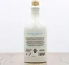 A white ceramic bottle of Gin Sul Dry Gin with a cork stopper, standing on a wooden surface. Anteprima dell’immagine prodotto