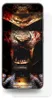 A smartphone with a screen displaying a fierce, bloody lion's face wearing samurai armor. Produktbild-Vorschau