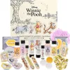 A collection of Winnie the Pooh themed cosmetic and bath products arranged around an advent calendar. Produktbild-Vorschau