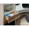 A drawer in a desk with LED lights and some papers inside, next to a laptop on the desk and a fluffy chair on the floor. Produktbild-Vorschau