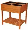 A wooden raised garden bed with multiple compartments and a lower shelf. Voir les images du produit