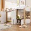 A child's house-shaped loft bed with storage and toys. Voir les images du produit