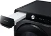 A close-up view of the detergent drawer of a black Samsung washing machine, with the drawer partially pulled out. Produktbild-Vorschau