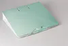 A mint green binder with a wave pattern on a light gray background. Produktbild-Vorschau