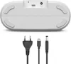 The bottom view of a white digital radio and its power cables are shown against a white background. Voir les images du produit