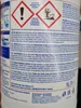 The image shows the back of a cleaning product bottle with various warning labels and instructions in multiple languages. Podgląd zdjęcia produktu