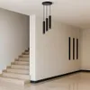 A modern interior with a staircase and a pendant light fixture. Podgląd zdjęcia produktu