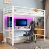 A loft bed with a desk and gaming chair setup, illuminated by pink LED lights. Produktbild-Vorschau