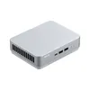 A silver ASUS mini PC is shown from a diagonal angle on a white background. Podgląd zdjęcia produktu