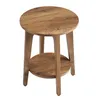 A round, wooden side table with a lower shelf is shown from a slightly elevated angle against a white background. Produktbild-Vorschau