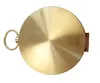 A top-down view of a round, brass compass with a hinged lid and a loop for attachment. Produktbild-Vorschau