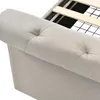 Close-up of a tufted upholstered bed frame, showing the side and part of the headboard, with wooden slats and a black grid visible inside the frame. Náhľad obrázku produktu