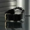 Close-up shot of the back of a black Casio Baby-G watch with a gold buckle. Anteprima dell’immagine prodotto