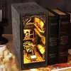 A DIY book nook kit designed to look like an astronomy portal, placed on a desk next to some books. Náhľad obrázku produktu