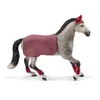 A toy horse with riding accessories. Produktbild-Vorschau