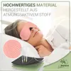 A woman is sleeping in bed wearing a pink eye mask. Close-up views of the material and layers of the mask are shown. Produktbild-Vorschau