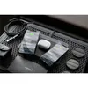 A collection of electronic accessories, including phones, earbuds, and charging accessories, arranged on a textured surface. Voir les images du produit