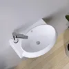 A modern bathroom sink with a chrome faucet mounted on a white shelf against a white wall, with wooden flooring visible. Produktbild-Vorschau
