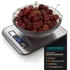 A digital kitchen scale with a bowl of cherries on top, displaying the weight. Náhled obrázku produktu