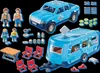 A collection of PLAYMOBIL toys including a pick-up truck, a caravan, figures, and accessories, arranged on a black background. Produktbild-Vorschau