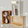 Three wooden crates are displayed, one with a vase and flowers, another empty, and a third white crate with a decorative item inside. Produktbild-Vorschau
