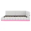 A white daybed with a hexagonal patterned headboard and a pink LED light strip along the base. Podgląd zdjęcia produktu