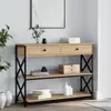 A console table with shelves and drawers, decorated with books, vases, and decorative objects. Náhled obrázku produktu