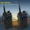 Two walkie-talkies are shown in the foreground with a blurred background of people hiking. Produktbild-Vorschau