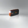 A black and orange Osram jump starter and power bank is shown on a reflective gray surface with a light gray background. Náhled obrázku produktu