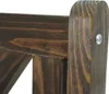 A close-up view of the dark brown wooden construction of a bench, showing the grain and joinery. Produktbild-Vorschau