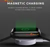 A smartwatch is shown on a magnetic charging pad, with green lines indicating charging. Produktbild-Vorschau