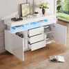 A modern white sideboard with LED lighting, drawers, and doors, set in a well-lit room with a window view. Produktbild-Vorschau
