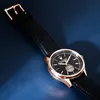 A close-up shot of a Maserati watch with a black leather strap and a rose gold case, set against a dark blue background. Podgląd zdjęcia produktu