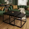 A living room scene with a green sofa, coffee tables, and a bookshelf. Produktbild-Vorschau