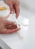 Hands are shown manipulating white foam sealing tape. Náhľad obrázku produktu