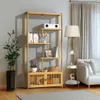 A wooden bookshelf filled with books and decorative items, placed in a living room setting next to a sofa and a floor lamp. Produktbild-Vorschau