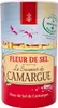 A cylindrical container of Fleur de Sel with a scenic illustration and text labels. Voir les images du produit
