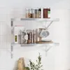 Two silver stainless steel wall shelves mounted on a white tiled wall, displaying kitchen items. Anteprima dell’immagine prodotto