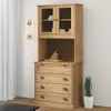 A wooden highboard with glass doors and drawers, set against a white wall with two decorative wall hangings. Náhled obrázku produktu