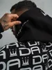 DADA Supreme Oversize Hoodie mit Allover Logo Druck und Produktbild-Vorschau 4