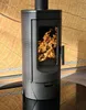 A black freestanding wood-burning stove with a fire burning inside, set against a wooden background. Náhľad obrázku produktu